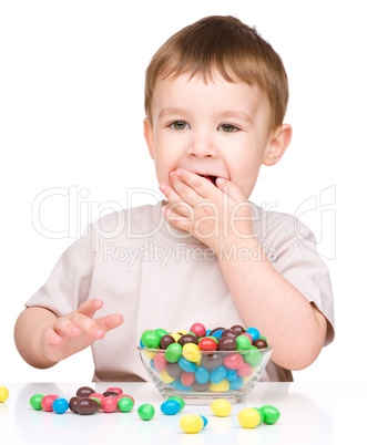 Portrait of a boy with candies