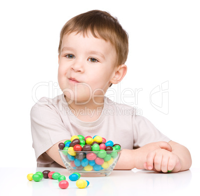 Portrait of a boy with candies