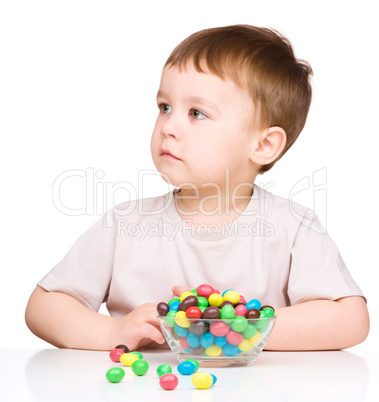 Portrait of a boy with candies