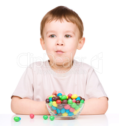 Portrait of a boy with candies