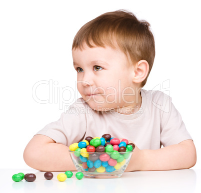 Portrait of a boy with candies