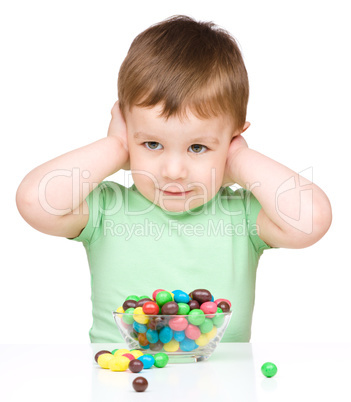 Portrait of a boy with candies