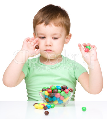 Portrait of a boy with candies