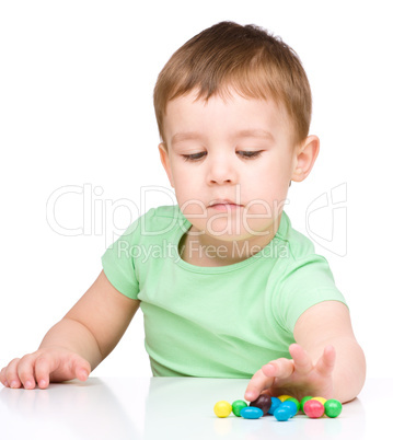 Portrait of a boy with candies