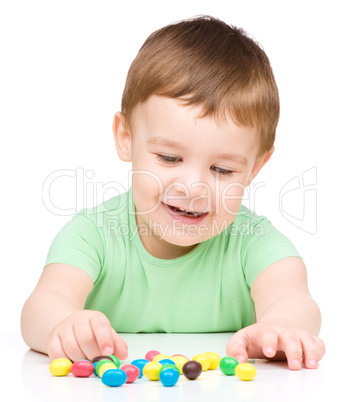 Portrait of a boy with candies