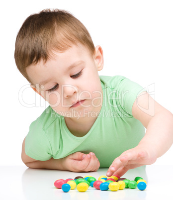 Portrait of a boy with candies