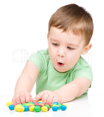 Portrait of a boy with candies