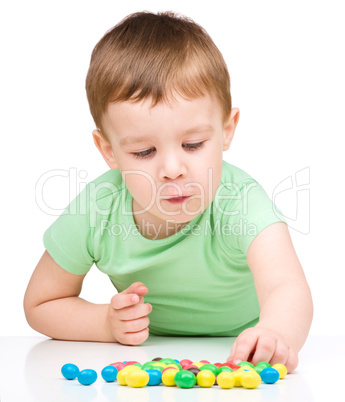 Portrait of a boy with candies