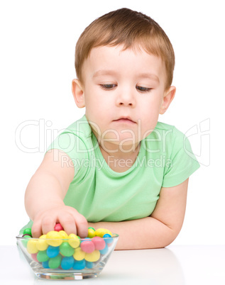 Portrait of a boy with candies