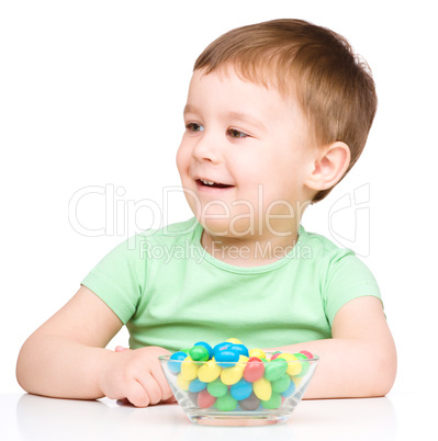 Portrait of a boy with candies