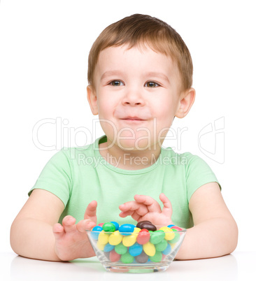 Portrait of a boy with candies