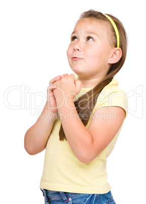 Cute little girl is praying