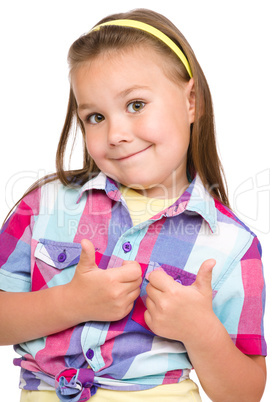 Little girl is showing thumb up gesture