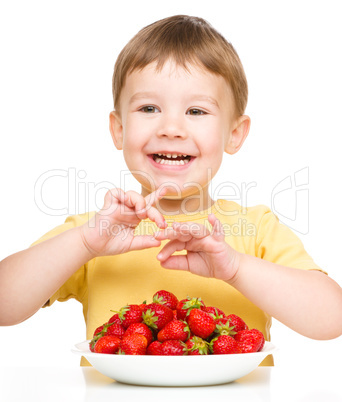 Little boy with strawberries