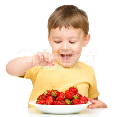 Little boy with strawberries