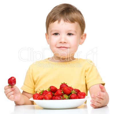 Little boy with strawberries