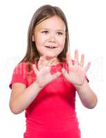 Portrait of a little girl making stop gesture
