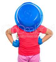 Little girl put a blue bucket on her head