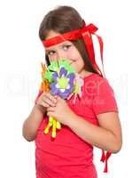 Cute little girl wit a bunch of flowers