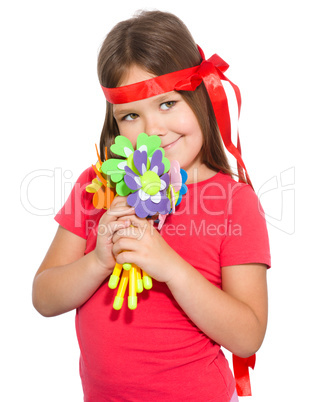 Cute little girl wit a bunch of flowers