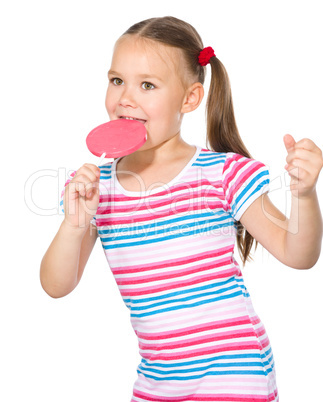 Little girl with lollipop