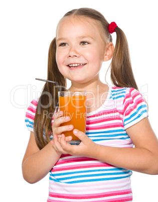 Little girl is drinking carrot juice Little girl is drinking carrot juice