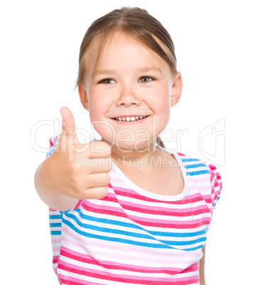 Little girl is showing thumb up gesture