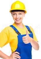 Young construction worker is showing thumb up sign