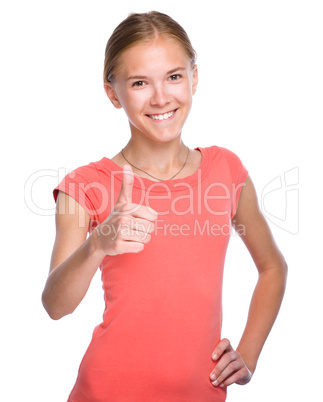 Young girl is showing thumb up gesture