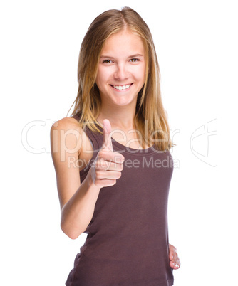 Woman is showing thumb up gesture