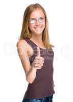 Young teen girl is showing thumb up gesture
