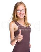 Young teen girl is showing thumb up gesture