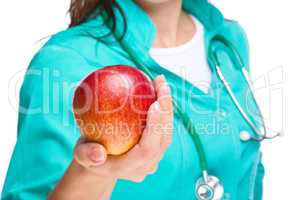 Lady doctor is holding a red apple