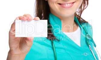 Doctor is showing her business card