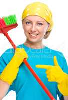 Young woman as a cleaning maid