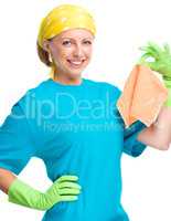 Young woman holding cleaning rag