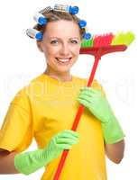 Young woman with broom - cleaning concept