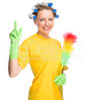 Young woman holding static duster