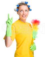 Young woman holding static duster