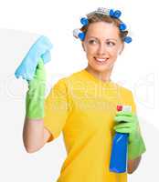 Young woman is cleaning glass using rag