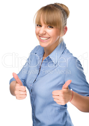 Woman is showing thumb up gesture