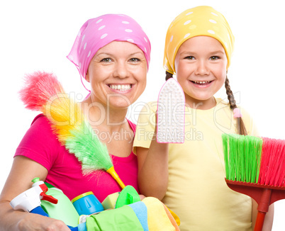 Mother and her daughter are dressed for cleaning