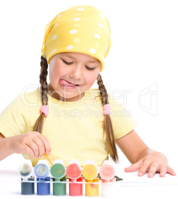 Cute child play with paints