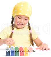 Cute child play with paints