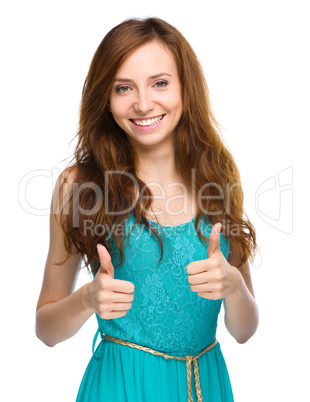 Woman is showing thumb up gesture