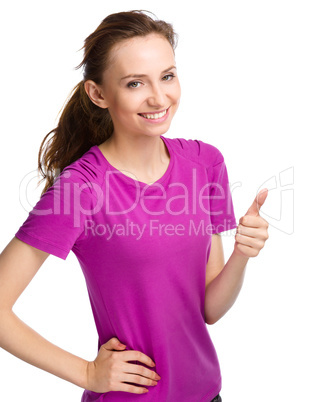 Woman is showing thumb up gesture