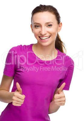 Woman is showing thumb up gesture