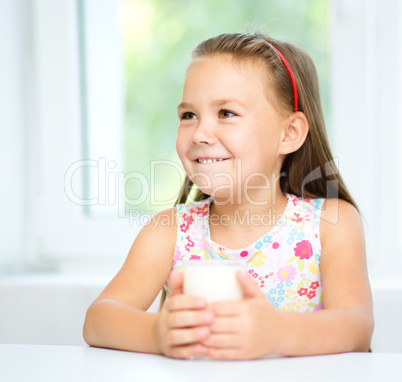 Cute little girl with a glass of milk