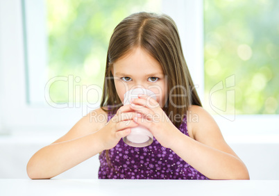 Little girl with a glass of milk