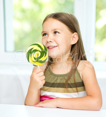 Little girl with lollipop